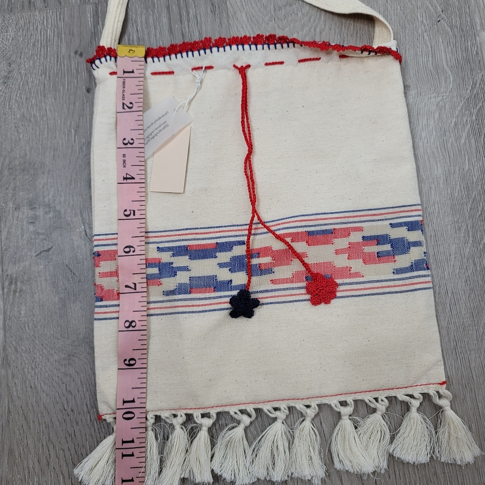 Boho fabric crossbody bag with knit string and flowers and fringe. 10"×9" - Picture 5 of 8
